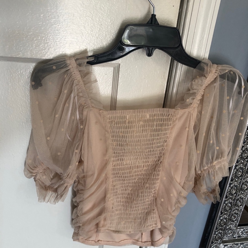 Beautiful cream stylish top with light cream polka dots from H&M.